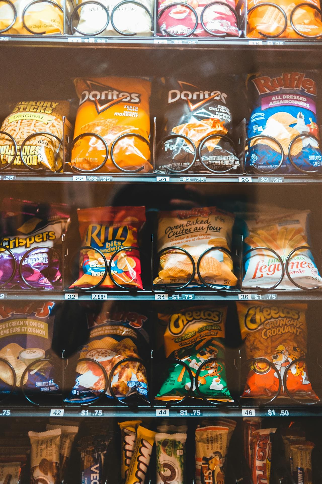 Close-up of a modern snack vending machine stocked with popular snack brands